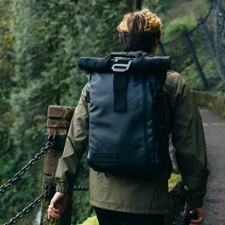 Person hiking with a WANDRD bag